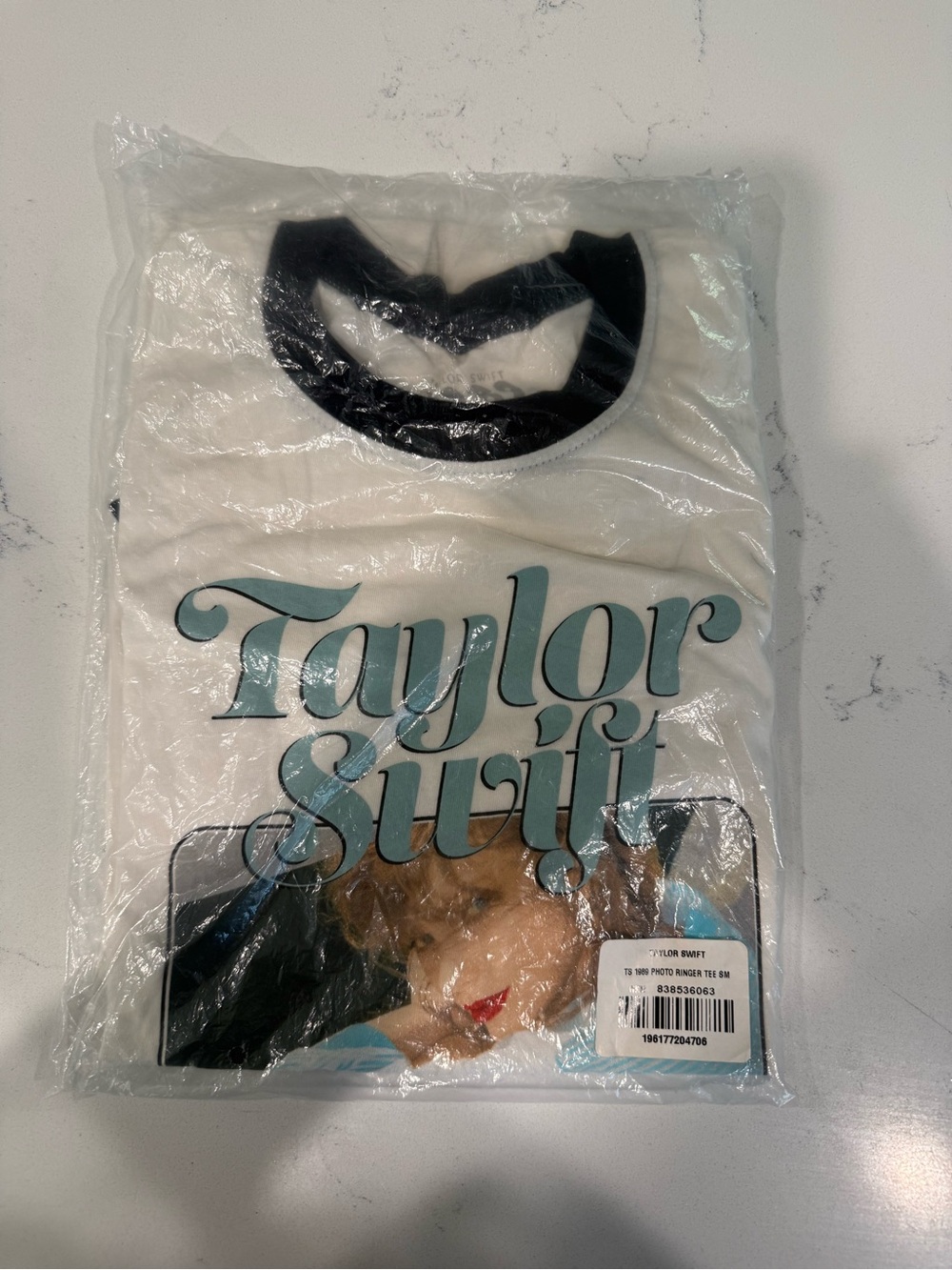 Taylor Swift Cream Short Sleeve Tee with Black Trim and Teal Script